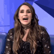 a woman with a choker on her neck is making a face