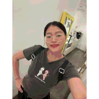 a woman wearing glasses and a t-shirt that says angels and demons