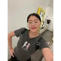 a woman wearing glasses and a t-shirt that says angels and demons