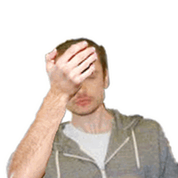 a man in a grey hoodie wipes his forehead with his hands