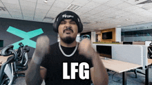 a man wearing headphones and a shirt that says lfg on it