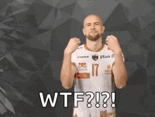 a bald man with a beard is wearing a shirt that says wtf