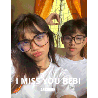a picture of a boy and a girl with the caption " i miss you bebi arghhhh "