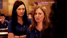 two women are standing next to each other in front of a sign that says mon-thur 9 pm