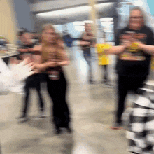 a blurry picture of a group of people standing around