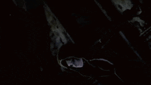 a close up of a video game character with a hood on their head .