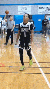 a basketball player with rwe on his shirt