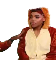 a woman wearing a lion costume is being touched by another person