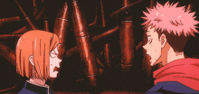 a man and a woman are standing next to each other and the woman is pointing at the man