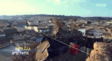 an aerial view of a city with the words live on the bottom right