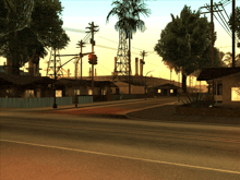 a computer generated image of a city street with palm trees