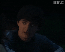 a close up of a person 's face with the word netflix in the corner
