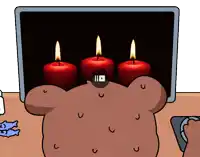 three candles are lit up in front of a computer screen