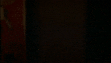 a close up of a ghostly screaming face in the dark