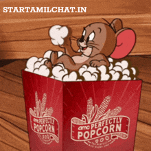 jerry mouse is sitting in a box of perfectly popcorn