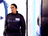 a woman in a space suit has a patch on her chest that says space shuttle on it