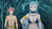 a man and a woman are standing in a cave