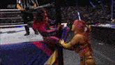 two women in a wrestling ring with a aew logo on the corner