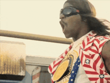 a man wearing sunglasses and a shirt that says ' united states ' on it