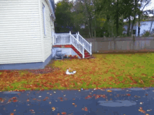 a white house with stairs leading up to it