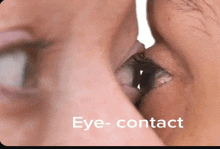 a close up of a person 's eye with the word eye- contact written below it