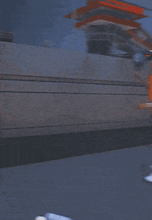 a man wearing an orange shirt with the number 10 on it is holding a tennis racket