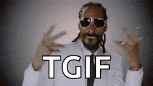 snoop dogg wearing sunglasses and a white suit says tgif