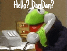 kermit the frog is talking on a telephone and says hello dan dan ?