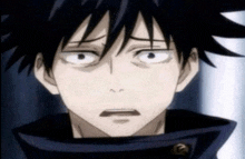 a close up of a person 's face with a shocked look on his face .