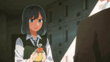 a girl holding a bag of chips in front of lockers
