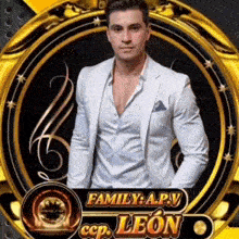 a man in a white suit is standing in front of a gold circle with the name family a.p.v. on it .