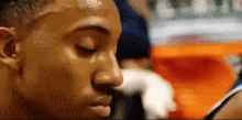 a close up of a person 's face with sweat coming out of it .