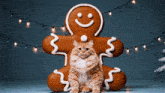 a cat is sitting on a gingerbread man