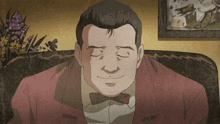 a man with his eyes closed is wearing a bow tie