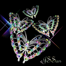 three butterflies are surrounded by rainbow colored rhinestones on a black background with the word swan on the bottom