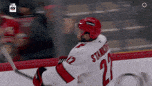 a hockey player wearing a number 21 jersey