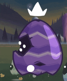 a purple easter egg with a white crown on top