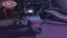 a group of people are standing in a dark room with a purple background .