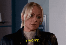 a woman in a black jacket and sweater says i won t