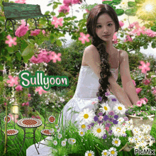 a girl in a white dress sits in a garden with the name sullyoon