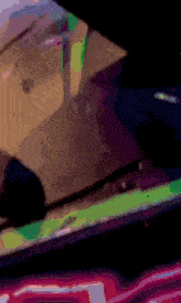 a blurred image of a person 's face with a purple background