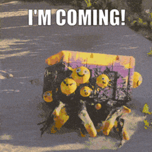 a picture of a box with smiley faces on it and the words " i 'm coming "