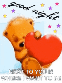 a teddy bear is holding a red heart on a good night card .