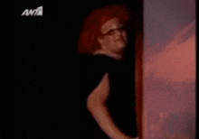 a woman with red hair is wearing glasses and a tag that says 6981 on it