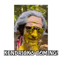 a man with a yellow face and the words kendrick 's coming on the bottom