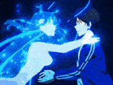 a man and a woman are standing next to each other and the woman is glowing blue .