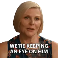 a woman in a blue dress says we 're keeping an eye on him