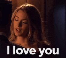 a woman kissing a man with the words " i love you " below her