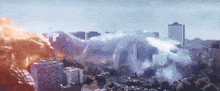 an aerial view of a city with buildings on fire and smoke coming out of it