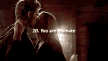 a close up of a woman 's face with the words `` you are intimate '' written over it .